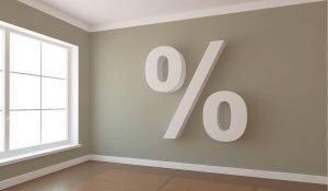 An empty room with a percent sign on a green wall
