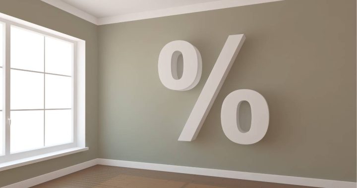 An empty room with a percent sign on a green wall