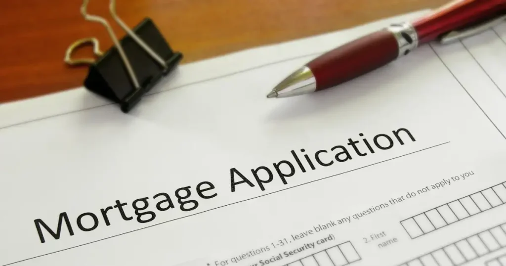 mortgage application form on a table with a pen on top.