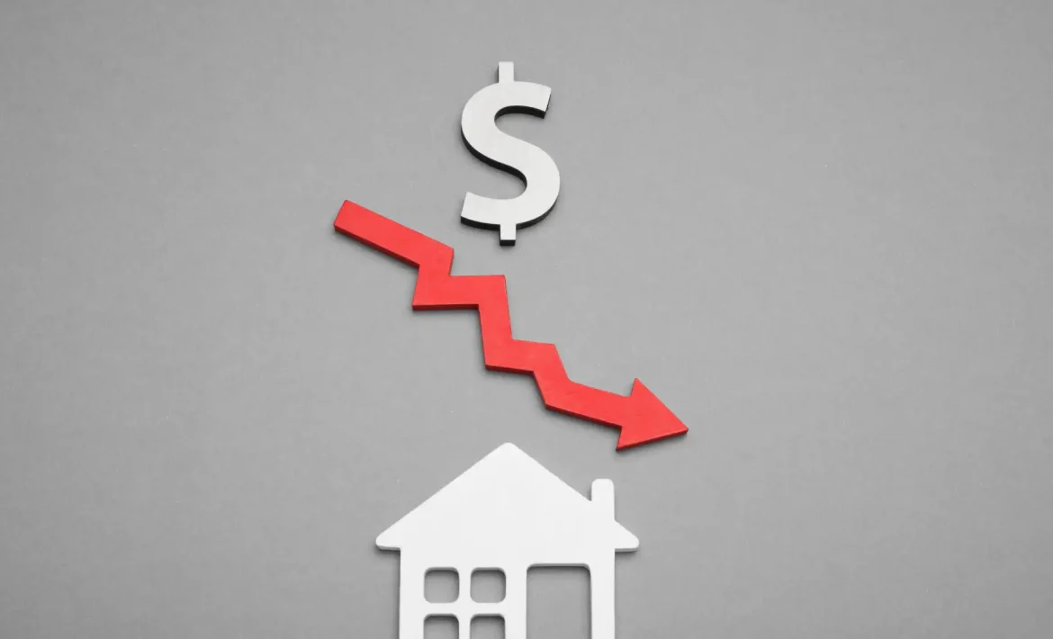 dollar sign with a red arrow point down placed above a house cutout on a grey background